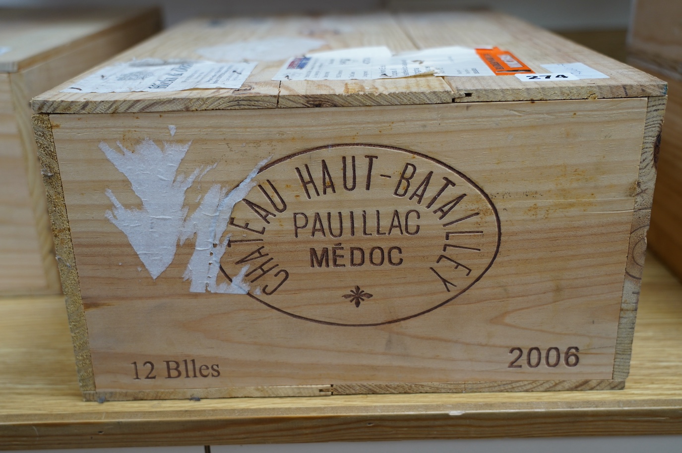 A sealed case of twelve bottles of Chateau Haut Batailley 2006. Condition - good